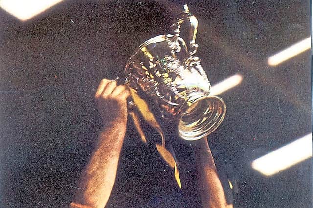 Wolves captain Emlyn Hughes raises League Cup trophy