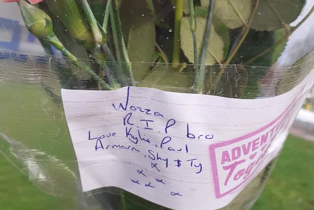 Flowers near the murder scene on Friday