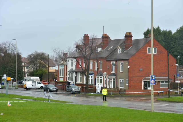 The police cordon on Pensnett Road, next to the house which was raided before the stabbings
