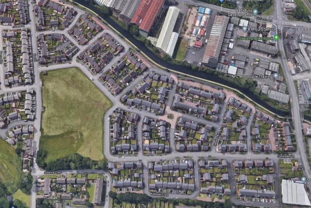 An aerial view showing the green space, left, and the development