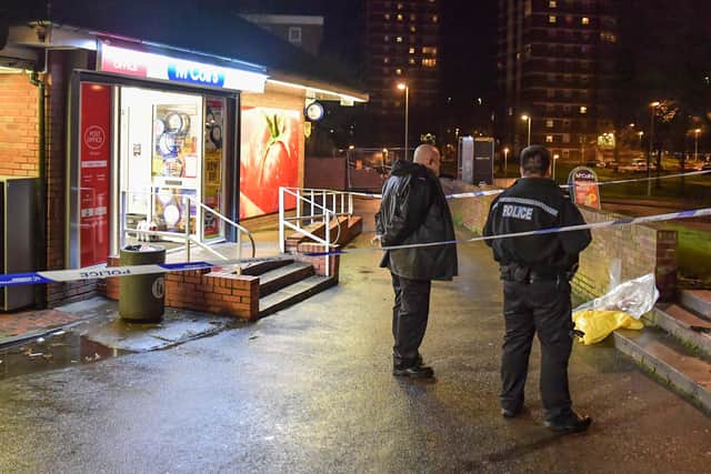 Police outside the McColl's shop where the man went for help. Photo: SnapperSK