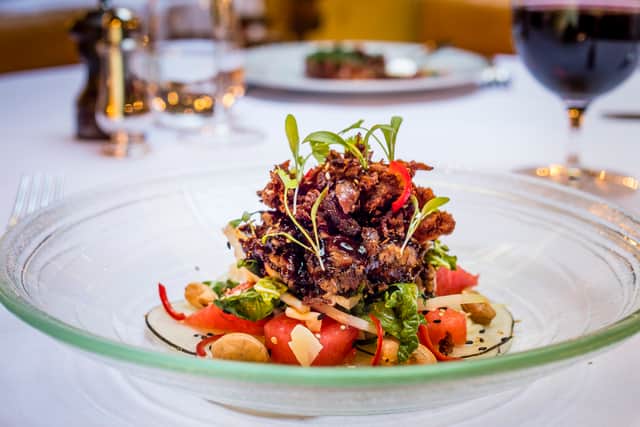A crispy duck salad with five spice dressing