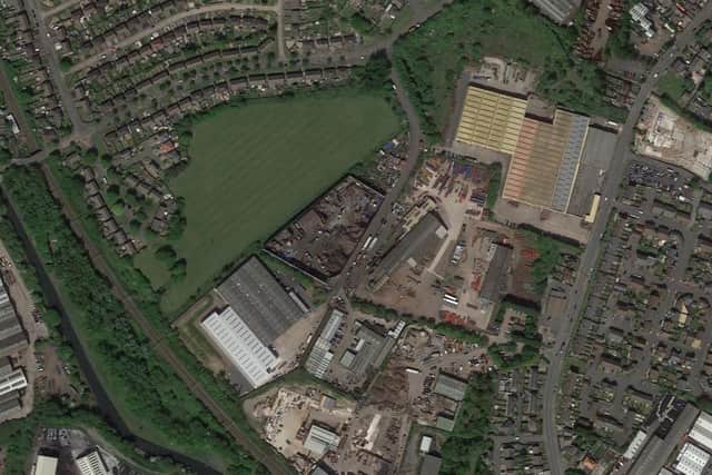 The land off Budden Road, centre, is the location for the new travellers transit site is close to homes and businesses