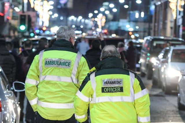 Paramedics walk up Broad Street in Birmingham as revellers partied hard last festive season