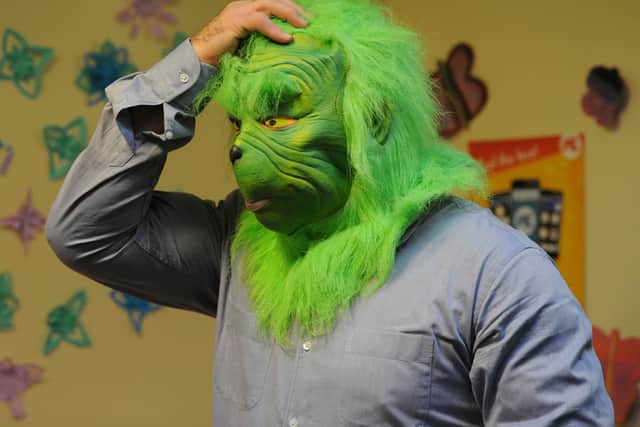 Ready to steal Christmas? Former EastEnders star Ross Kemp dons a Grinch mask for Villiers Primary School's festive video