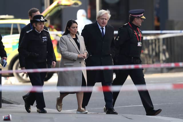 Metropolitan Police Commissioner, Cressida Dick (left), Home Secretary, Priti Patel, Prime Minister Boris Johnson and Commissioner of the City of London Police, Ian Dyson (right) attend the London Bridge crime scene. Credit: Steve Parsons/PA Wire