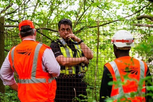 Police and railway officials at the scene after the boys were injured