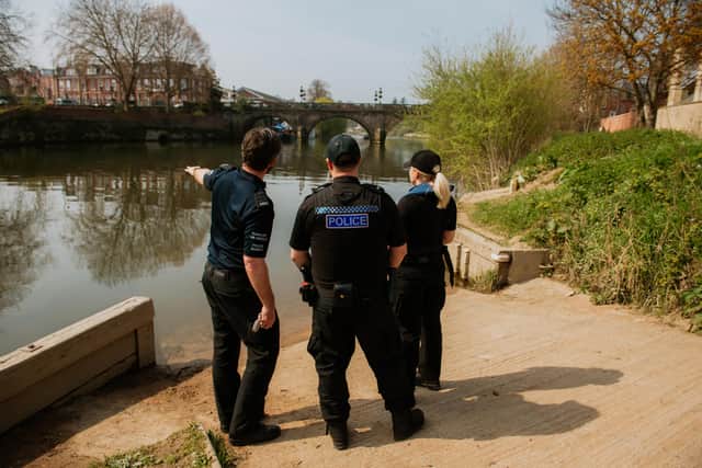 Search teams in Frankwell near where the car entered the water