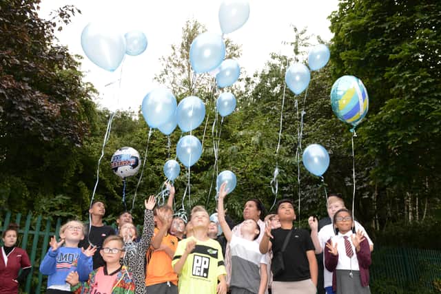 School friends released balloons into the sky to remember their classmate Sanjay following the tragedy