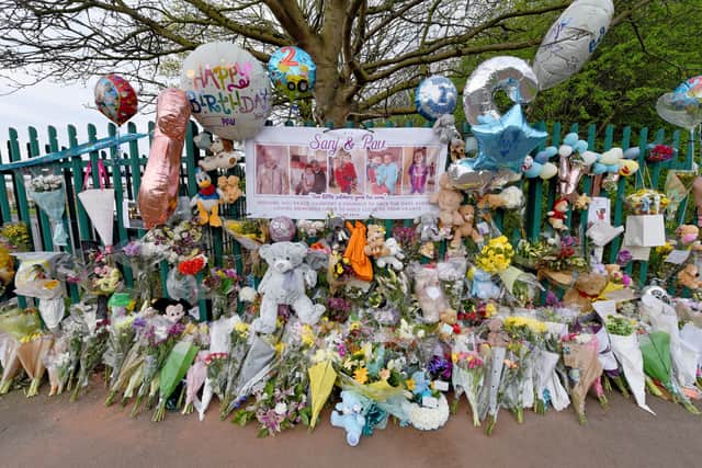 Dozens of floral tributes and toys were left in memory of the brothers