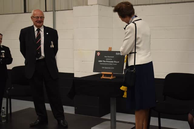 HRH The Princess Royal unveils a plaque to mark the opening of St John Ambulance’s West Bromwich operations and training hub, flanked by CPG chairman Keith Hunter.