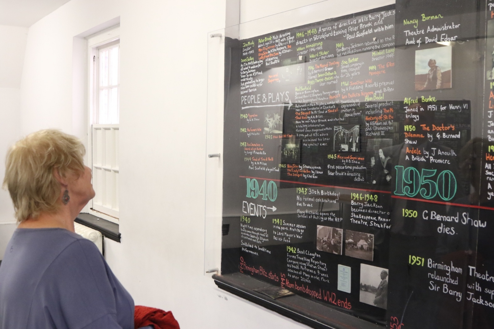 Annette Badland looking at the timeline on display at Birmingham's Old Rep Theatre