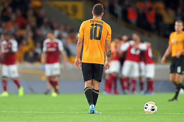 Patrick Cutrone walks back to the centre circle as Braga celebrate in the background (AMA/Sam Bagnall)