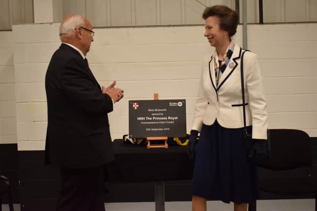 HRH The Princess Royal unveils a plaque to mark the opening of St John Ambulance’s West Bromwich operations and training hub, flanked by CPG chairman Keith Hunter.