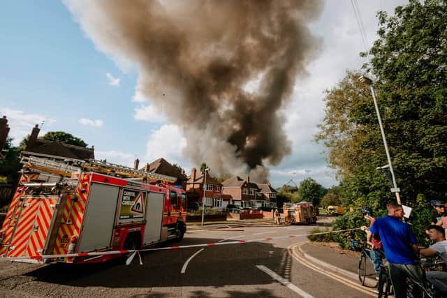 Smoke from the fierce fire at the Holiday Inn could be seen rising above nearby homes