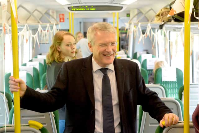 Then-rail minister Andrew Jones was one of the first people to travel on the new line