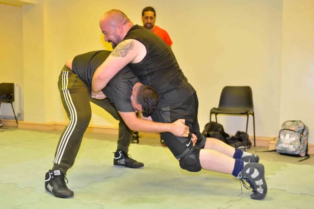 James Vukmirovic, Express and Star Community Reporter, tries to fight off Muslim Mohammed
