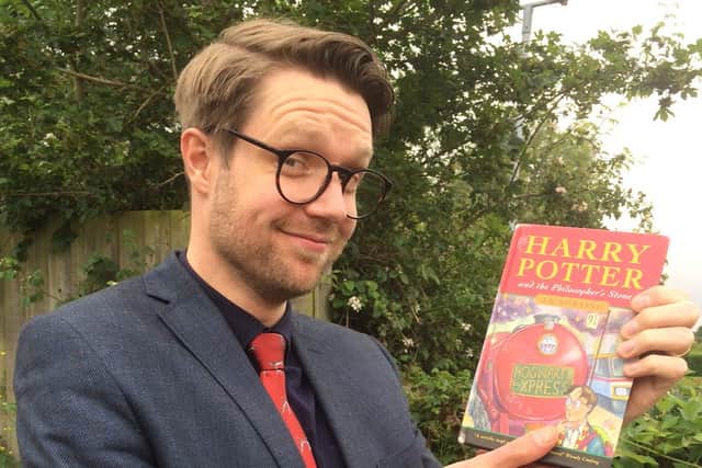 Jim Spencer from Hansons auctioneers with the first-edition book going on sale