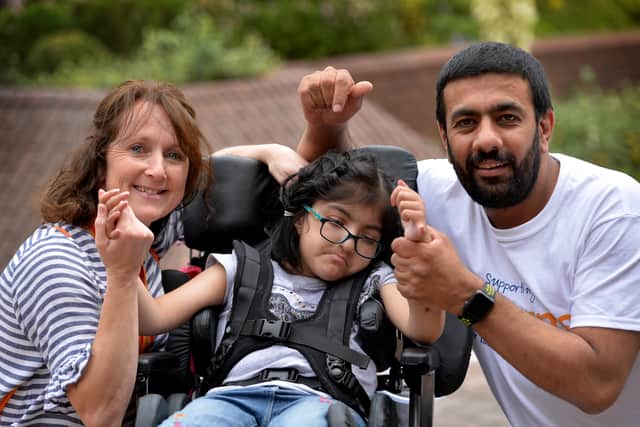 Hospice at home nurse Wendy Porter, Amjid Mehmood and his daughter Zara Khan who rely on the service.