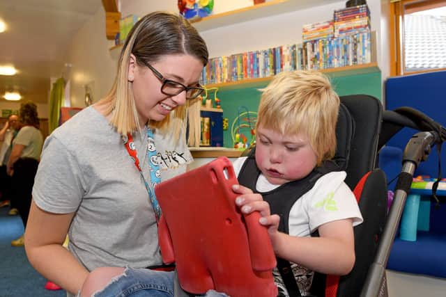 Staff nurse Beth Parker with nine-year-old Mason Williams