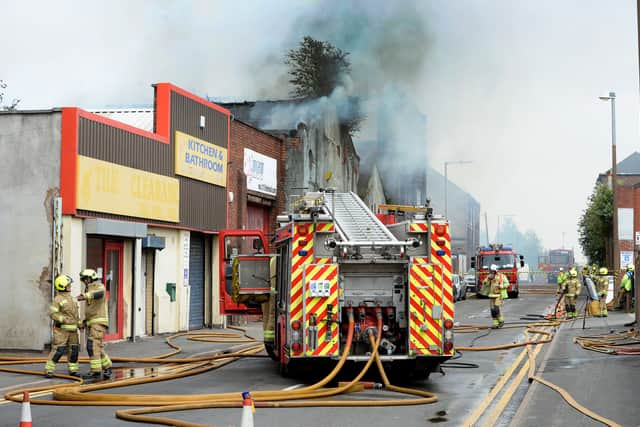 Fire crews remained at the scene dampening down into the evening