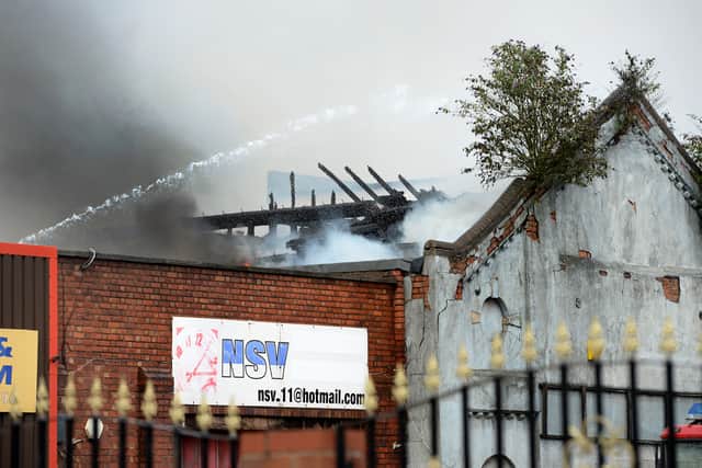 Exposed roof beams show the destruction of the fire