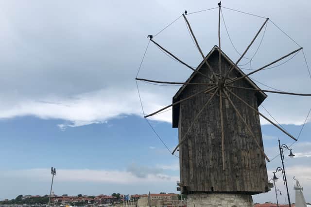 A large windmill sits at the entrance of old town Nessebar