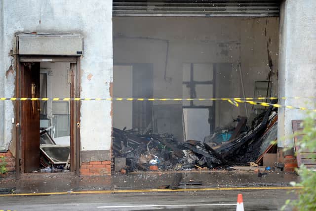 Some of the debris visible inside the fire-ravaged premises