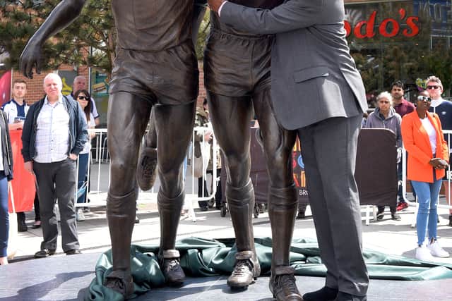 Brendon Batson pictured with the Three Degrees statue after the unveiling