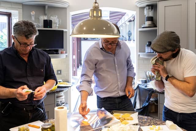 Food artist Carl Warner and his team creating the piece