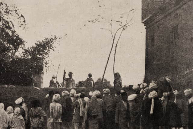 A speaker addressing a crowd from behind the lowest part of the southern wall in late 1919