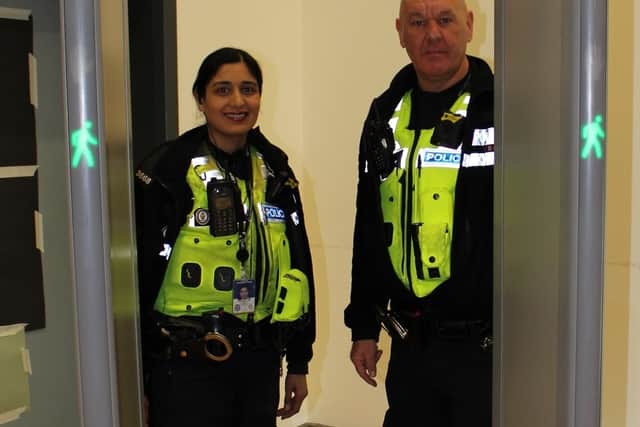 Police officers Manjit Batth and Ian Probert with the knife arch at Grace Academy Darlaston