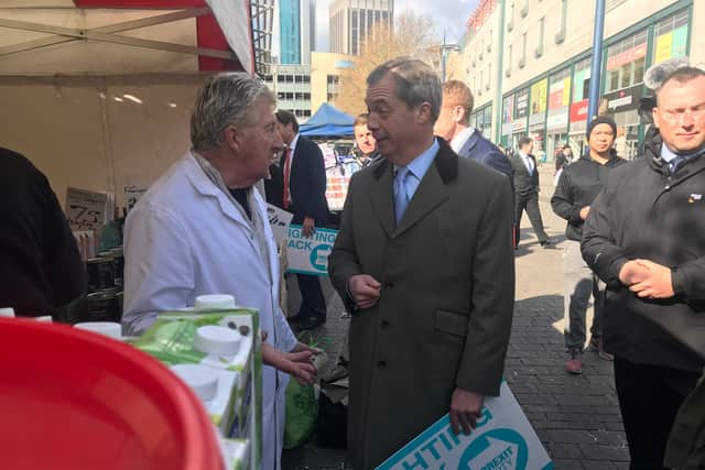 Nigel Farage meeting stall holder Roger Brown