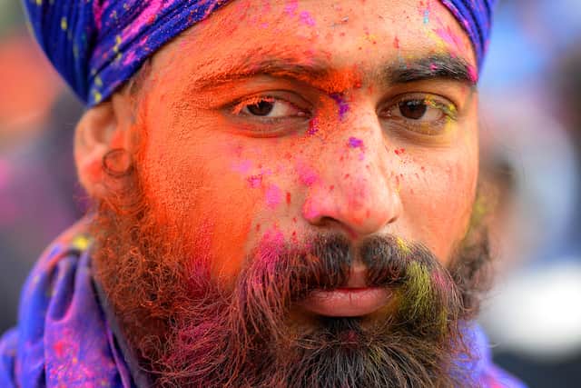 Colourful paint was thrown around during the occasion