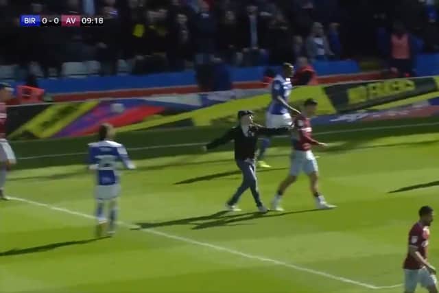 A fan attacks Aston Villa's Jack Grealish
