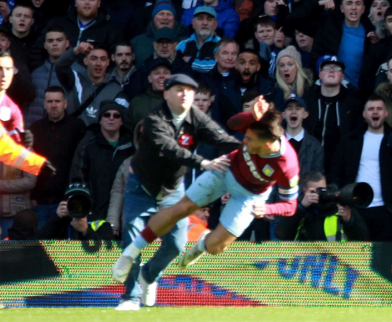 A fan attacks Villa captain Jack Grealish. Photo: Andy Shaw for the Express & Star