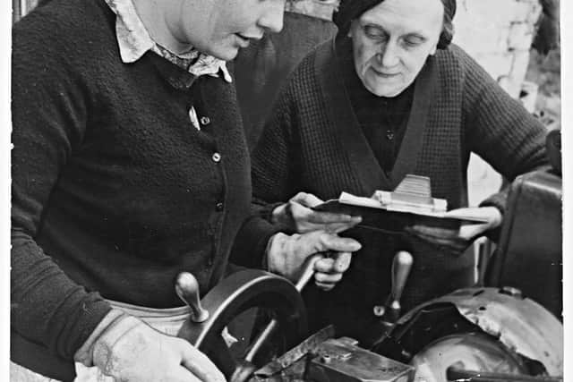 July 22, 1970: Family blacksmiths, Joseph Wyle & Co. in Blackheath was established in 1860. Photograph shows Ellen Beese teaching her daughter Elizabeth as the firm adapted to 20th century techniques – going metric.