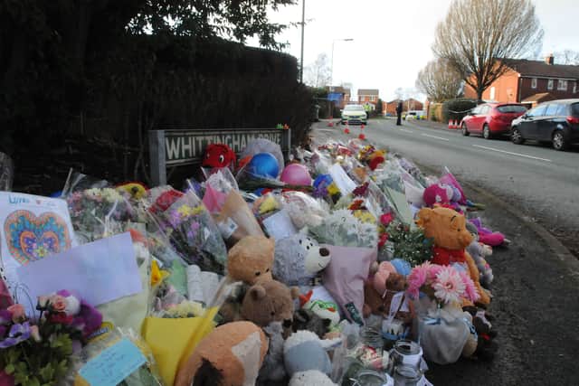 Dozens of flowers, teddy bears and tributes were left at the scene