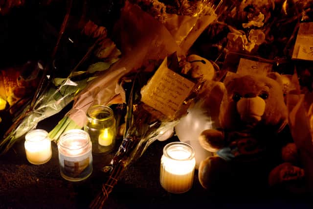 Candles and tributes left in memory of the children at last week's vigil