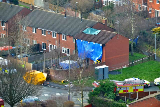 The damaged house after the fatal fire