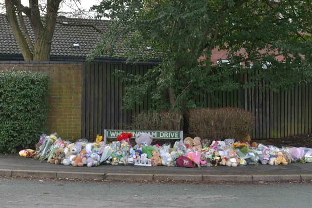 Some of the floral tributes left in memory of the young victims