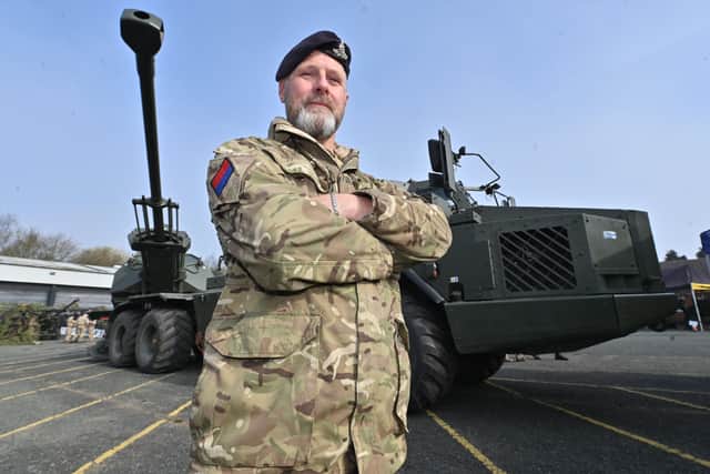 Fallings Park, Wolverhampton and Royal Artillery open day event. Troop Sgt Major: Richard Chance from Wolves,  next to a huge bit of kit called The Archer.