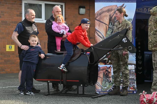 Fallings Park, Wolverhampton and Royal Artillery open day event.    The Kings Troops and Joanna Waddington chats to: Adrian Lewis, Harry Morgan 6, Dan Cox, Abigail Cox 2 and Rupert Cox 5 from Walsall.