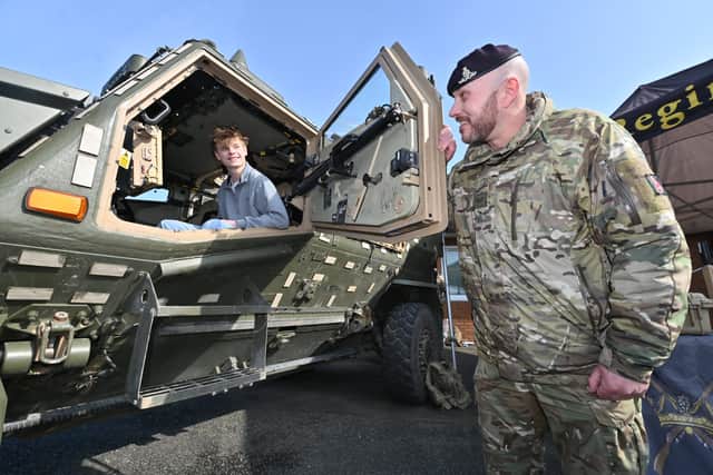 Fallings Park, Wolverhampton and Royal Artillery open day event.   Pictured is: Harley LaCourse 15 from Shrewsbury chats to Bombadier: Chris Allen from the North East.