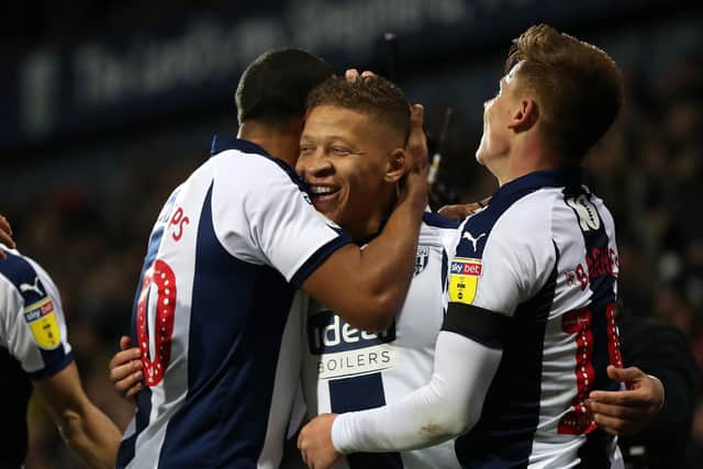 Dwight Gayle celebrates with his teammates. (AMA)
