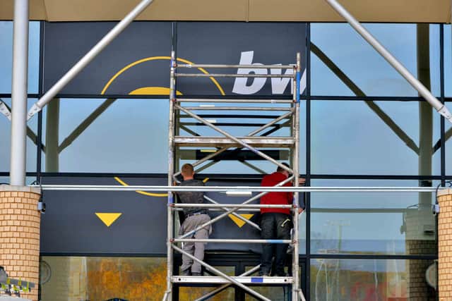 Signs are installed on the outside of the building