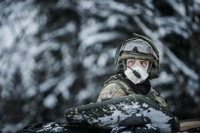 Soldier gazing from the turret of an Warrior vehicle wearing his cold weather mask.Photo: Corporal Sam Jenkins 