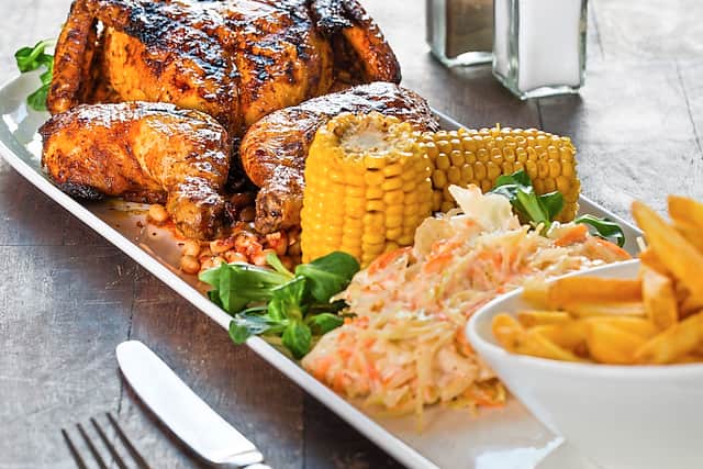 Roast chicken and chips with corn and coleslaw