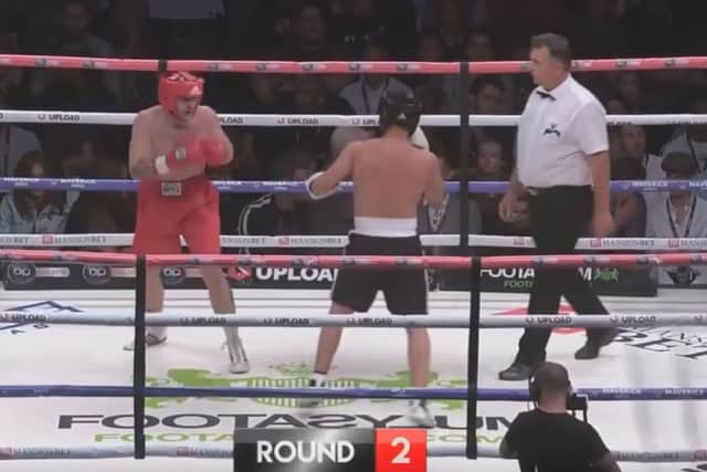 Jay, in red, taking on AnEson Gib
