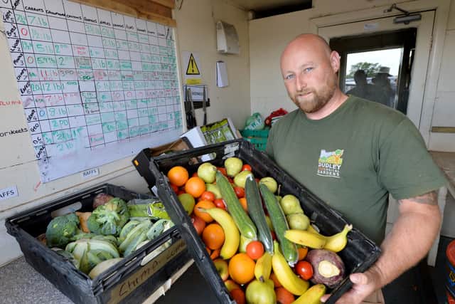 Gary Arnold sorts out the fruit and veg which will be making their way to the different sections across the 40-acre site
